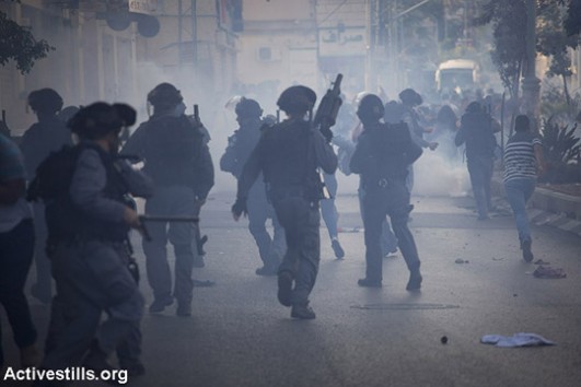 Israeli border police shoot tear gas at an anti-war protest organized by Palestinian citizens of Israel, Nazareth. At least 10 were arrested. (photo: Oren Ziv/Activestills.org)