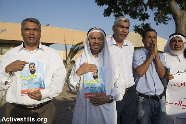 Palestinians shout slogans during a protest for the release of Palestinian Mohammed Allan, who is held by Israel without trial and who has slipped into a coma after a nearly two-month hunger strike, in the city of Bedouin city of Rahat, August 18, 2015. (photo: Oren Ziv/Activestills.org)