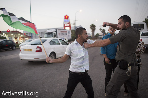 Israeli police detains a Palestinian protester at a demonstration for the release of hunger striker Mohammad Allan, outside of Barzilai hospital in Ashkelon, Israel. (Oren Ziv/Activestills.org)