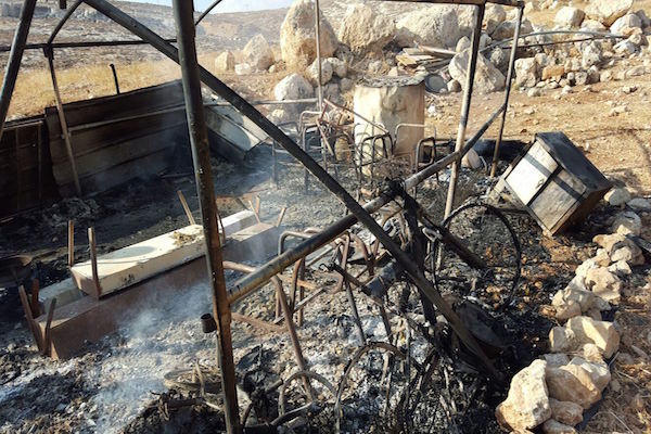 Torched tent of Palestinian Bedouin in alleged “Price Tag” attack in the West Bank village of Ein Samiya. August 12, 2015. (Zakaria Sadeh, Rabbis for Human Rights)