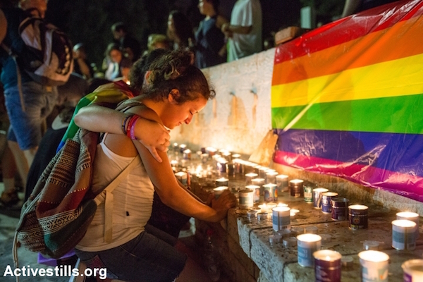 Israeli youth mourn Shira Banki, who was murdered by an ultra-Orthodox man at the Jerusalem Pride Parade, August 2, 2015. The attacker, Yishai Schlissel, stabled six people. (Yotam Ronen/Activestills.org)