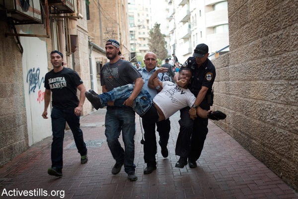 Illustrative photo of Israeli police arresting a right-wing activist wearing a T-shirt that reads ‘Death to the terrorists’ in West Jerusalem. (Activestills.org)