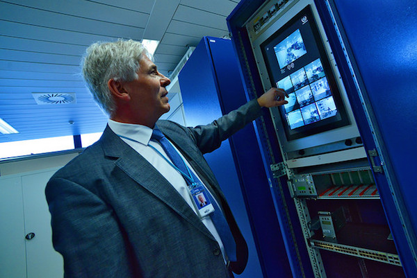An IAEA expert demonstrating how the safeguards Next Generation Surveillance System (NGSS) works, March 20, 2015. (Photo: Dean Calma / IAEA)