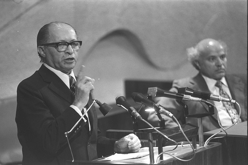 Menachem Begin speaking in the Knesset (Photo from Government Press Office-Wikimedia Commons).