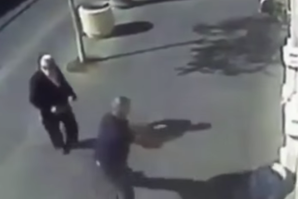 An armed security guard shoots a Palestinian teenager after she attempted to stab passersby, Jerusalem, November 24, 2015. (screenshot: CCTV)