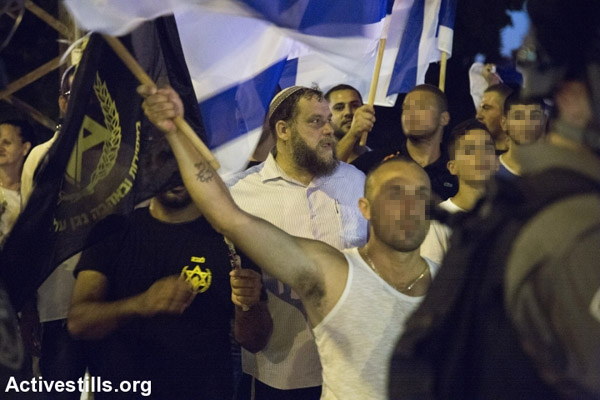 File photo of Lehava leader Benzi Gopstein with his supporters at a right-wing protest. (Photo by Keren Manor/Activestills.org)