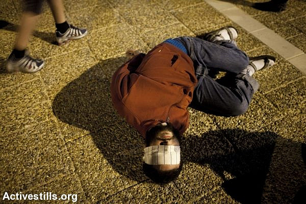 Israeli activists participate in an action protesting the use of torture, 2011. (photo: Oren Ziv/Activestills.org)