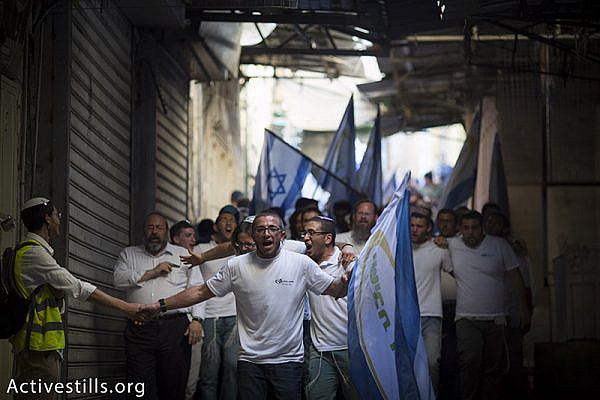 Israel youth walk during Jerusalem Day March held by Israeli nationalists that celebrate 48 years for the Israeli occupation of East Jerusalem, in Jerusalem's old city, May 17, 2015. The march is termed by the nationalists the Flag March. Activestills.org