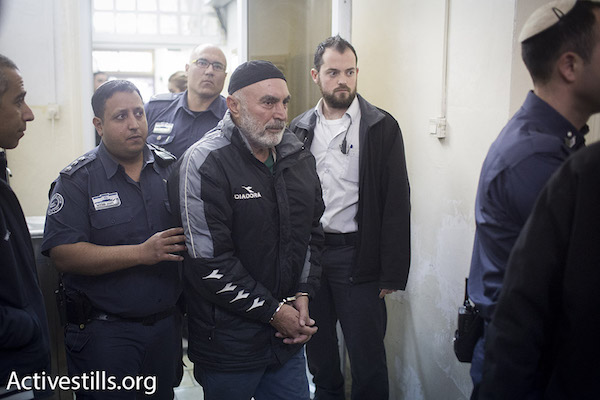 Ta’ayush member Ezra Nawi is brought to a Jerusalem court on January 20, 2016. Nawi, an Israeli Jew active opposing the occupation, was arrested after a right-wing organization put him in the crosshairs of a hidden-camera ‘sting operation.’ (Oren Ziv/Activestills.org)
