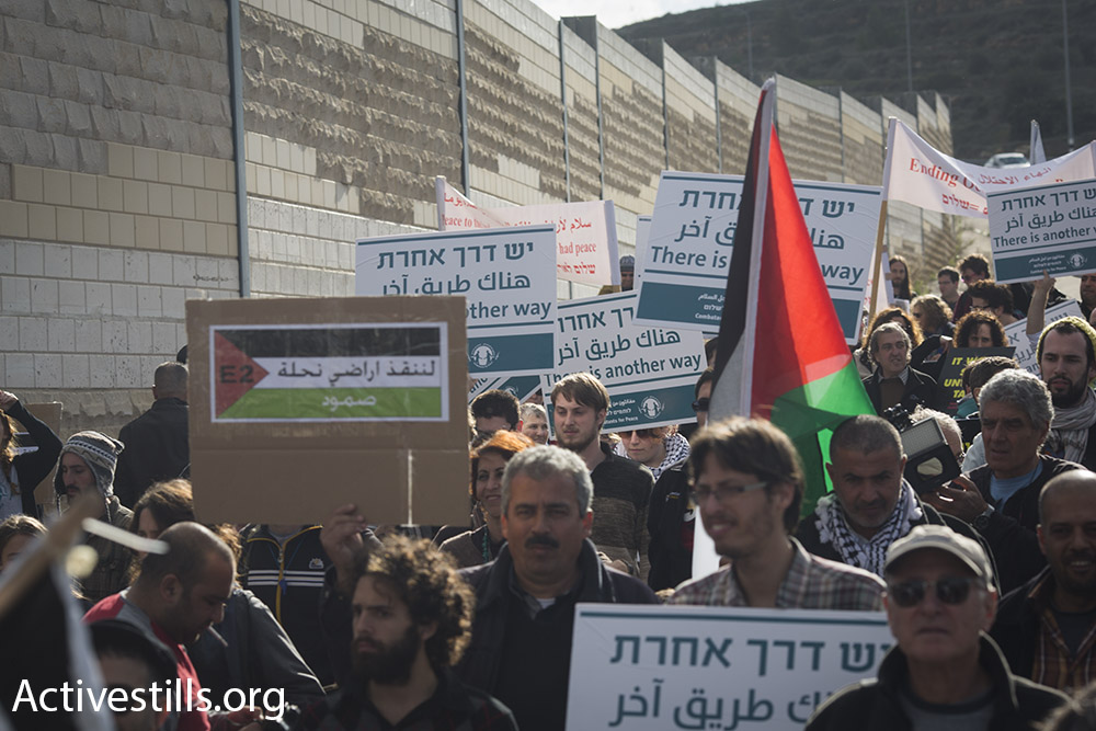Jewish Israelis and Palestinians march along the major Hebron-Jerusalem highway in the southern West Bank demanding an end to the occupation, January 15, 2016. (Oren Ziv/Activestills.org)