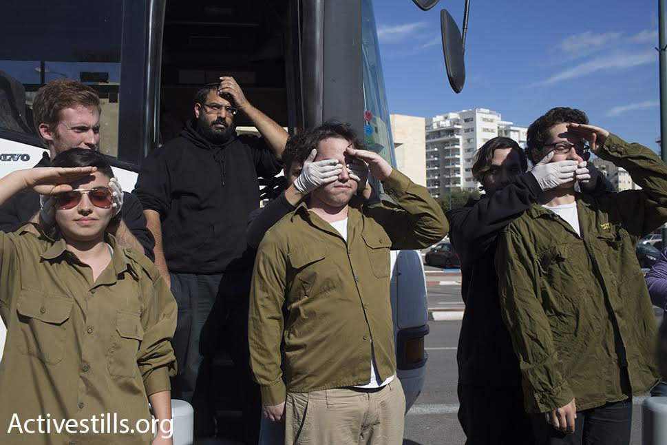 Demonstrators organize a performance in support of Tair Kaminer, a 19-year-old Israeli conscientious objector, at the Tel Hashomer induction base, Ramat Gan, Israel, January 10, 2016. (photo: Oren Ziv/Activestills.org)