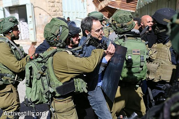 Israeli soldiers arrest Professor Gadi Algazi at a demonstration in Hebron calling on the army to ''open the Hebron Ghetto,' Hebron, West Bank, February 20, 2016. (photo: Oren Ziv/Activestills.org)