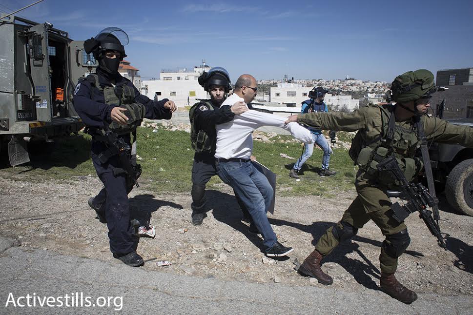 Israeli Border Policemen arrest a Palestinian during a protest in Hebron, February 26, 2016. (photo: Oren Ziv/Activestills.org)