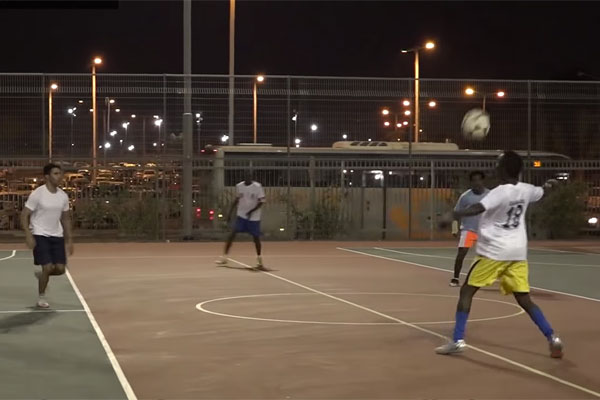 Asylum seekers from Holot play soccer with Israeli students in Be'er Sheva. (Social TV)