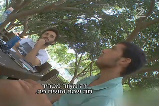 Screenshot from Ad Kan's hidden camera, capturing Breaking the Silence interviewing a right-wing mole.