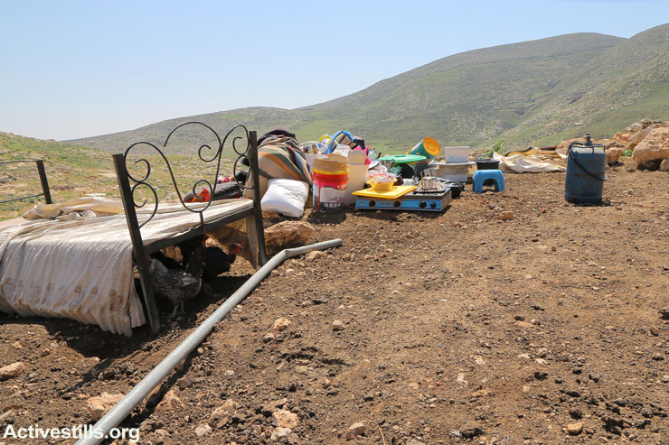 Furniture left out in the open after Israeli military forces demolished over a dozen buildings in the Khirbet Tana, a small Palestinian village in the Jordan Valley, West Bank, January 23, 2016. (Ahmad Al-Bazz/Activestills.org)