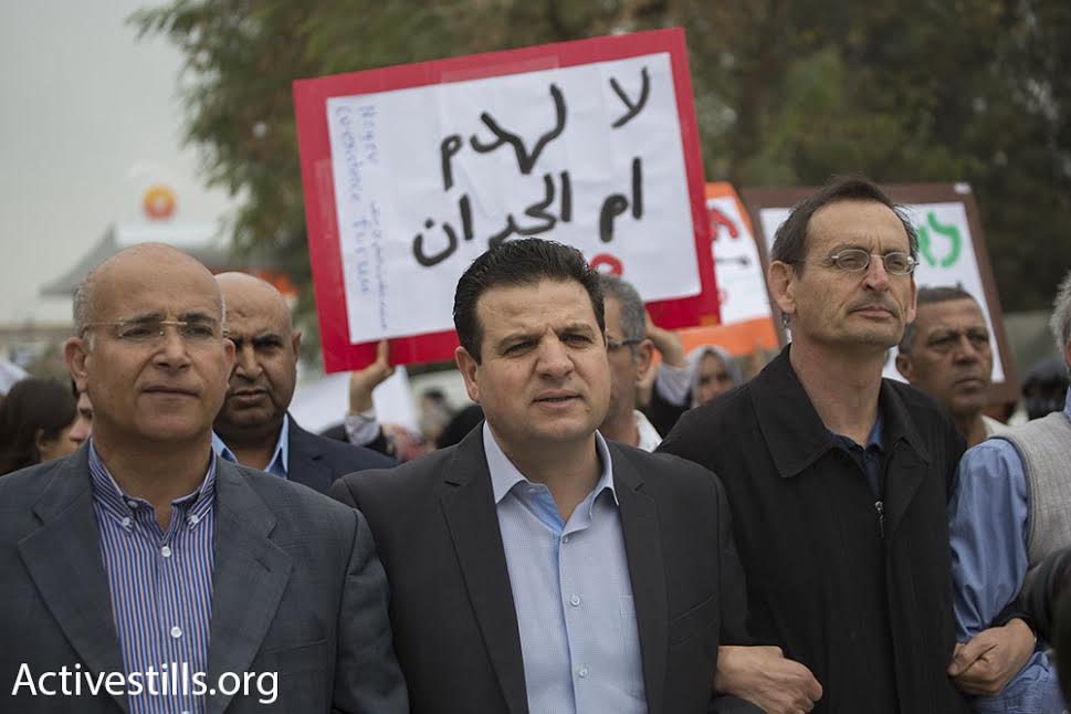 Members of the Knesset from the Joint List, including Ayman Odeh (center) and Dov Khenin (right) take part in a demonstration outside the Be'er Sheva District Court against the planned demolition of Umm al-Hiran and Atir, two unrecognized Bedouin villages in Israel's Negev Desert, March 3, 2016. (photo: Oren Ziv/Activestills.org)