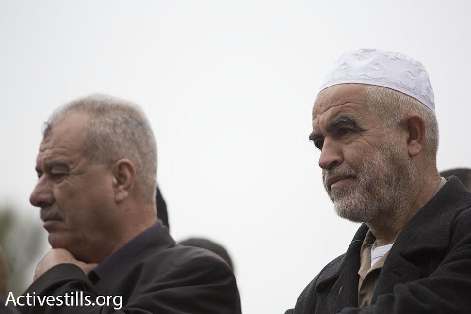 Arab Higher Monitoring Committee head Muhammad Barakeh (left) and leader of the outlawed Northern Branch of the Islamic Movement, Raed Salah, take part in a demonstration outside the Be'er Sheva District Court against the planned demolition of Umm al-Hiran and Atir, two unrecognized Bedouin villages in Israel's Negev Desert, March 3, 2016. (photo: Oren Ziv/Activestills.org)