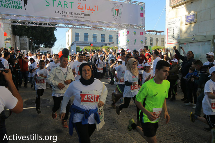 Runners at the starting line of the 2016 Palestine Marathon, Bethlehem, West Bank, April 1, 2016. (Ahmad al-Bazz/Activestills.org)