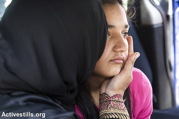 Dima al-Wawi is embraced by her mother after being released form 75 days in an Israeli prison, Jabara checkpoint, West Bank, April 24, 2016. (Keren Manor/Activestills.org)