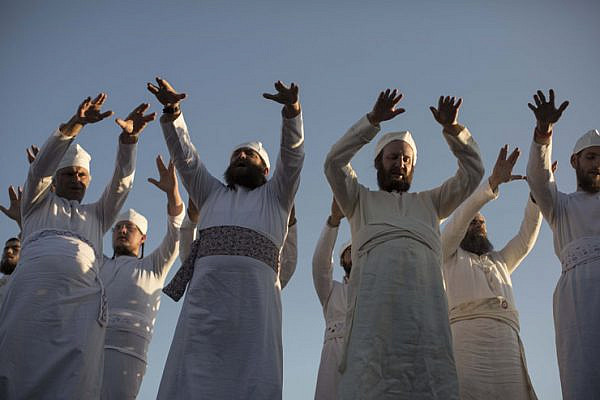 Cohanim, men said to be descended from the priestly tribe, perform a ritual during a ‘practice run’ of a pre-Passover Temple sacrifice, at-Tur, East Jerusalem, April 18, 2016. (Tali Janner-Klausner/Activestills.org)