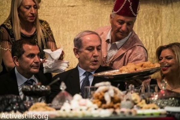 Prime Minister Netanyahu and Sara Netanyahu (right) during a Mimouna celebration. (photo: Activestills.org)