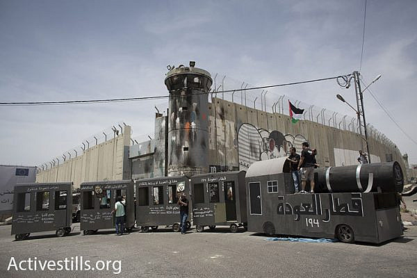 The ‘Return Train’ turns around at the Israeli separation wall, May 15, 2016. (Oren Ziv/Activestills.org)