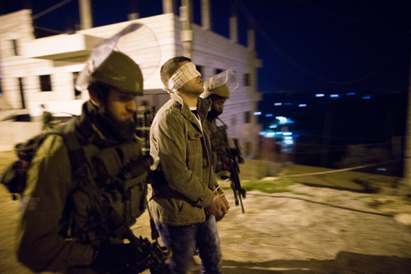 Illustrative photo of Israeli soldiers arresting a Palestinian man in the Dheisheh Refugee Camp near the West Bank city of Bethlehem. (Nati Shohat/Flash90)
