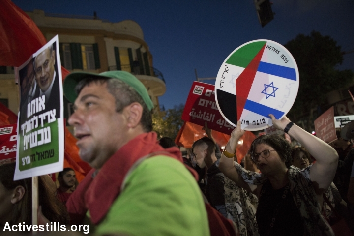 Jewish and Arab protesters march during a prtoest against the occupation, calling the Israeli government to resign, in central Tel Aviv, May 28, 2016. (photo: Oren Ziv/Activestills.org)