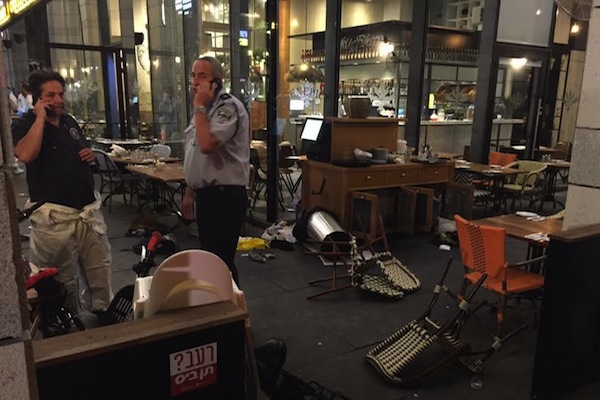 Israeli police seen at a restaurant in Sarona Market following the shooting attack that left four Israelis dead, central Tel Aviv, June 8, 2016. (photo: Israel Police Spokesperson)