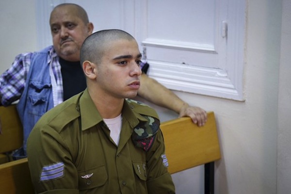 Elior Azaria, the Israeli soldier, who shot a Palestinian attacker in Hebron, is seen at a court hearing in Jaffa's military court, July 11, 2016. Azaria was filmed shooting the Palestinian in the head, after the latter posed no threat. (photo by Flash90)