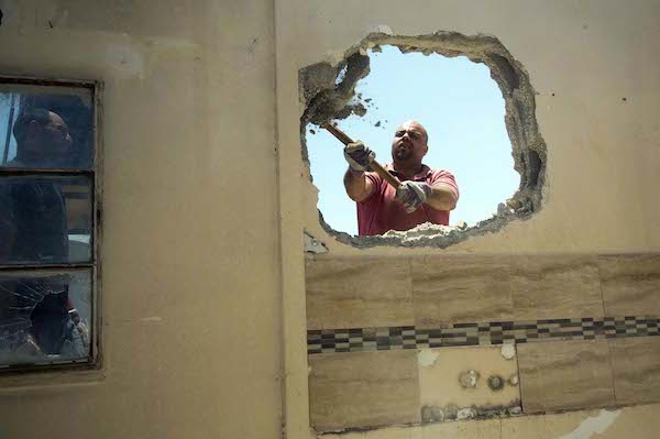 A Palestinian man demolishes his own home in Jerusalem after receiving a demolition order related to a lack of proper permits. (File photo Sliman Khader/Flash90) 