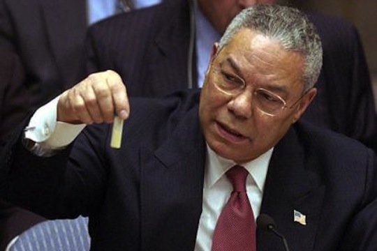 Colin Powell holding a model vial of anthrax while giving a presentation to the United Nations Security Council in February 2003.