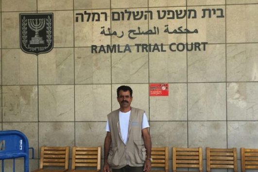 Ahmad Awad, whose son, Samir, was shot and killed by Israeli soldiers, stands outside Ramle Magistrate's Court, September 22, 2016. (photo: Haggai Matar)