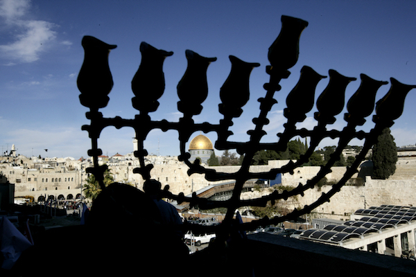 Illustrative photo of a hanukkiah in front of the Aqsa Mosque compound in the Old City of Jerusalem. (Abir Sultan/Flash90)