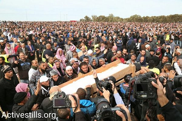 Thousands hold a funeral for Yacoub Abu al-Qi'an in the Bedouin village of Umm al-Hiran. Abu al-Qi'an was shot dead by police as security forces demolished homes in the village, January 24, 2017. (Keren Manor/Activestills.org)