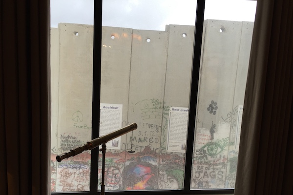 View of the separation wall from a room in The Walled Off Hotel, Bethlehem, March 3, 2017. (Haggai Matar)