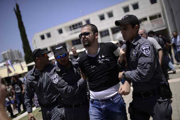 Israeli police detain a protester during a rally marking the anniversary of the Nakba, Tel Aviv University, May 20, 2015. (Tomer Neuberg/Flash90)