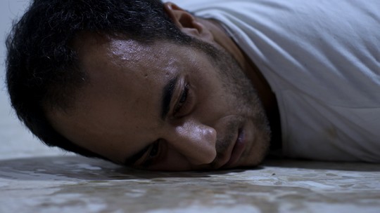 Ramzi Maqdisi on the floor of the prison, from the film "Ghost Hunting."