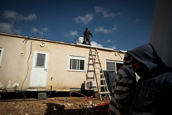 Illustrative photo of construction workers preparing new caravan homes in the Israeli settlement of Ofra. (Yaniv Nadav/Flash90)