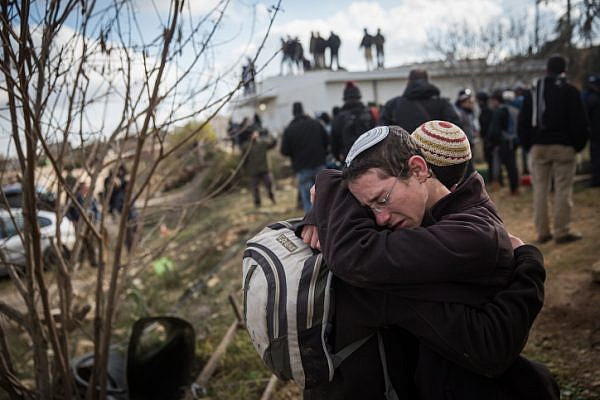 Young Jewish boys seen crying in the illegal outpost of Amona, February 1, 2017, during the settlement's evacuation. (Hadas Parush/Flash90)