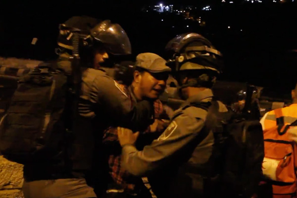 Israeli police arrest Activestills photographer Faiz Abu Rmeleh at the Lions Gate in the Old City of Jerusalem, July 25, 2017. (Screenshot)