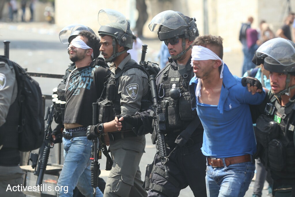 Police arrest a Palestinian demonstrator in the East Jerusalem neighborhood Wadi Joz, July 21, 2017. (Oren Ziv/Activestills.org)