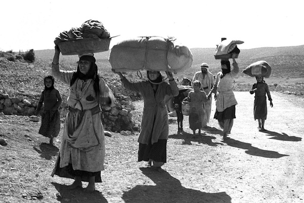 Palestinians flee from their village in the Galilee during the 1948 War, after it was conquered by Israeli forces. (GPO)
