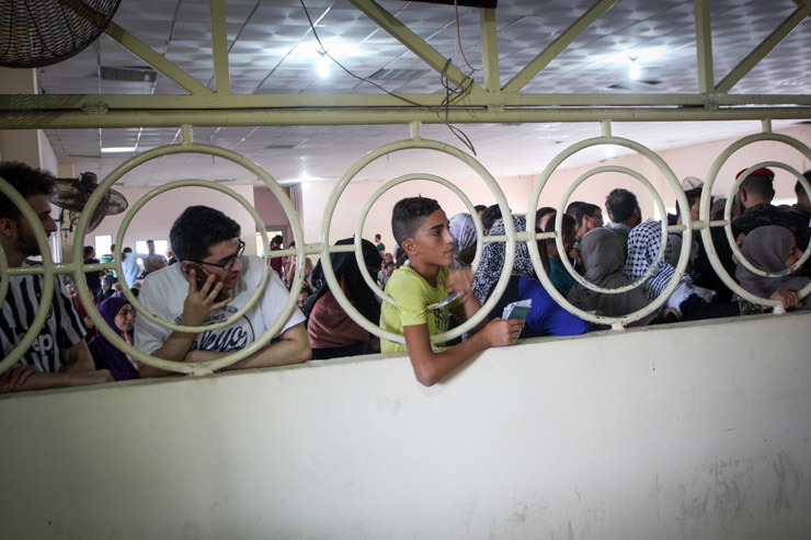 Palestinians wait in the Rafah border crossing terminal during a rare five-day period in which Egypt allowed passengers to pass through, August 16, 2017. (Abed Rahim Khatib/Flash90)