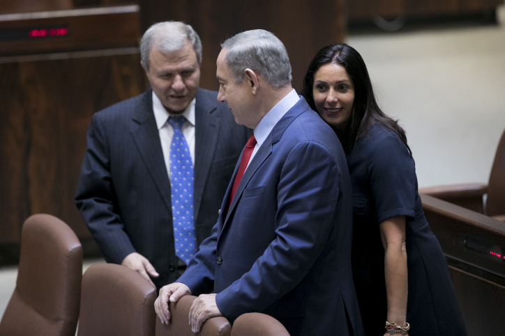 Israeli Culture Minister Miri Regev walks behind Prime Minister Benjamin Netanyahu in the Knesset during the opening of the winter session, Jerusalem, October 31, 2016. (Yonatan Sindel/Flash90)
