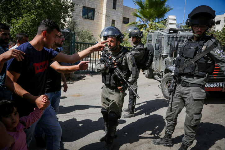 Israeli security forces outside the house of Nimr Jamal who opened fire on Israeli security forces at the Har Adar settlement, in the West Bank village of Beit Surik, September 26, 2017. (Flash90)