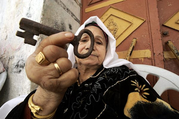 Laila Abdel Meguid Tafesh, 78, from Rafah refugee camp, holds up a key from her house in Jaffa, May 15, 2009. (Abed Rahim Khatib/Flash90)