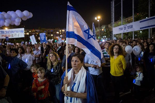 Israelis attend a rally marking 22 years since the assassination of Israeli Prime Minister Yitzhak Rabin, Tel Aviv's Rabin Square, November 4, 2017. (Miriam Alster/Flash90)