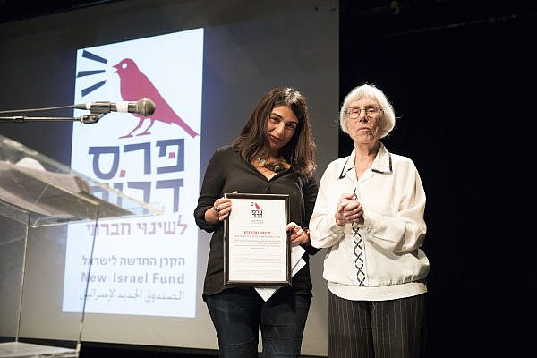 Local Call editor Orly Noy accepts the Dror Prize from former Supreme Court Justice Dalia Dorner, Tel Aviv, December 1, 2017. (Oren Ziv/Activestills.org)